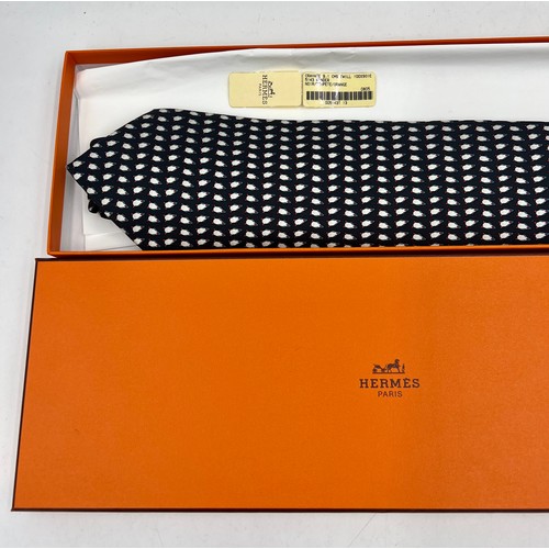 883 - An Hermès silk tie with penguin decoration in original presentation box.