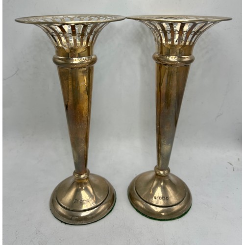 857 - Hallmarked silver to include two vases with weighted bases, Sheffield 1910, 18cm h, candlestick, Bir... 