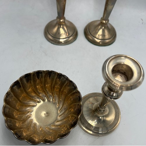 857 - Hallmarked silver to include two vases with weighted bases, Sheffield 1910, 18cm h, candlestick, Bir... 