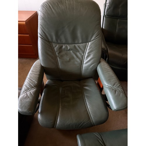 101 - Five dark green leather Stressless chairs all with footstools. One footstool opening up for storage.