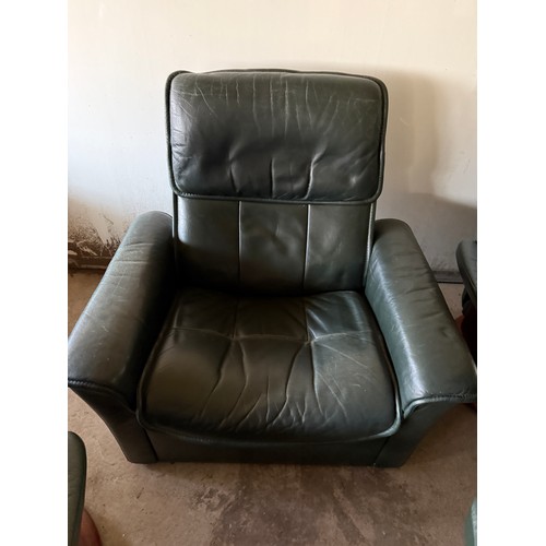 101 - Five dark green leather Stressless chairs all with footstools. One footstool opening up for storage.