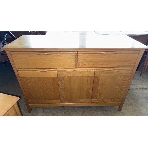 102 - A beech sideboard, 2 drawers over 3 cupboards 133 w x 51 d x 90cm h together with television cabinet... 