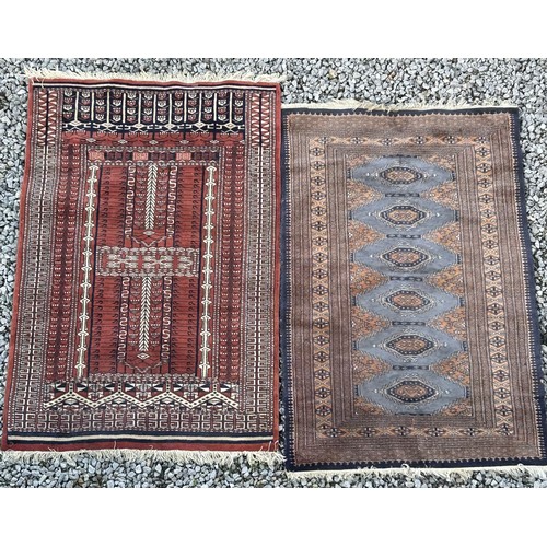 1105 - Two wool rugs. Red ground 150 x 96cm excl. tassels, blue ground 94 x 146cm excl. tassels.