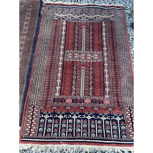 1105 - Two wool rugs. Red ground 150 x 96cm excl. tassels, blue ground 94 x 146cm excl. tassels.