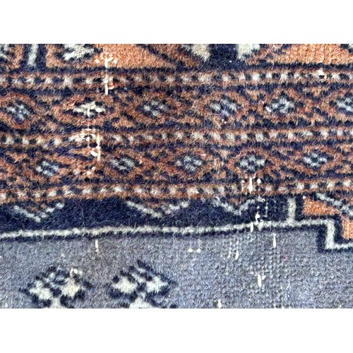 1105 - Two wool rugs. Red ground 150 x 96cm excl. tassels, blue ground 94 x 146cm excl. tassels.