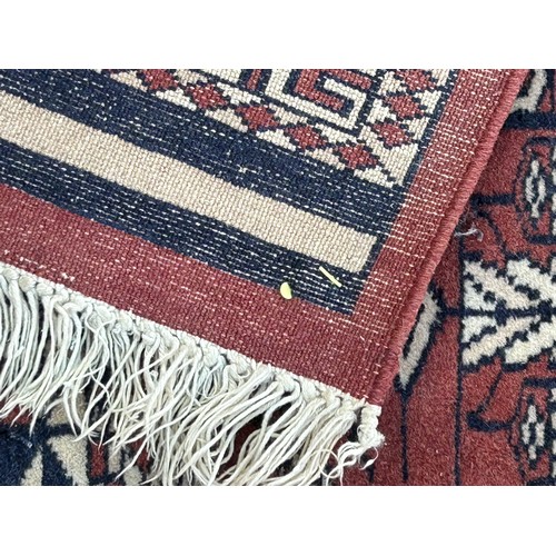 1105 - Two wool rugs. Red ground 150 x 96cm excl. tassels, blue ground 94 x 146cm excl. tassels.