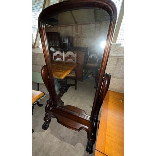 1031 - A mahogany framed cheval mirror. 148 h x 90cm w.