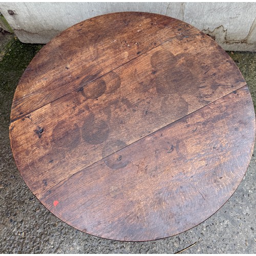 103 - A circular mahogany table. 76 d x 52cm h.