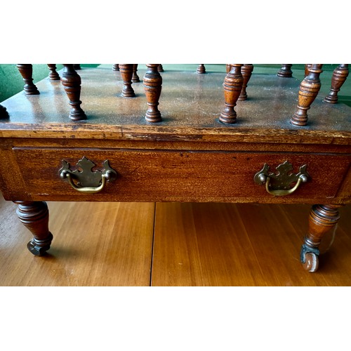 104 - An Edwardian mahogany canterbury on castors with single drawer to base. 53 w x 36 d x 48cm h.