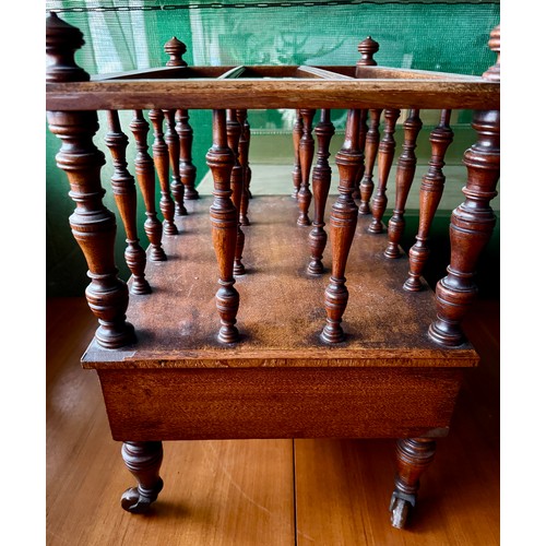 104 - An Edwardian mahogany canterbury on castors with single drawer to base. 53 w x 36 d x 48cm h.