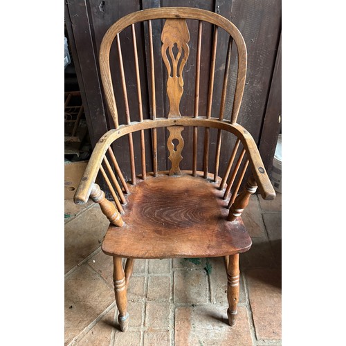 110 - A 19thC Windsor armchair.