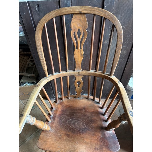 110 - A 19thC Windsor armchair.