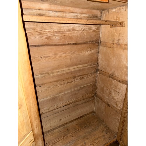 115 - A two door pine cupboard on bracket feet. 95 w x 153 h x 51cm d.