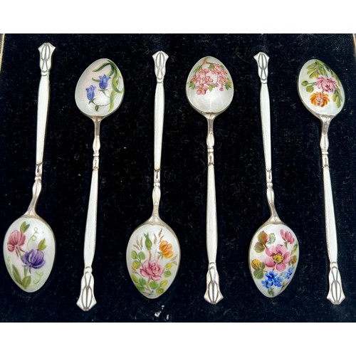 860 - Six boxed silver and enamel coffee spoons, each with differing floral decoration. Total weight 55gm.... 