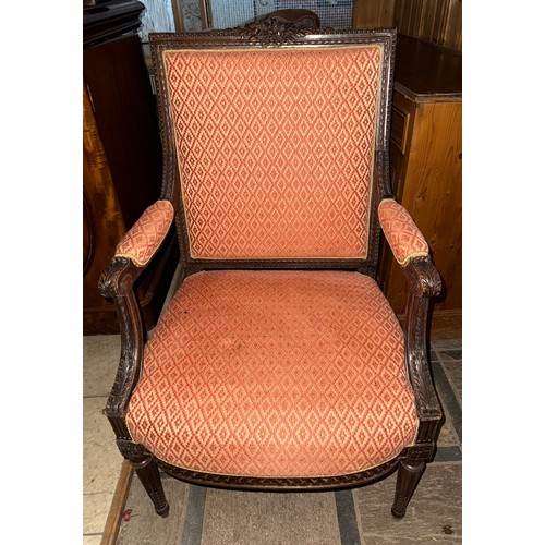 119 - A good quality well upholstered open armchair with carved wood surround.