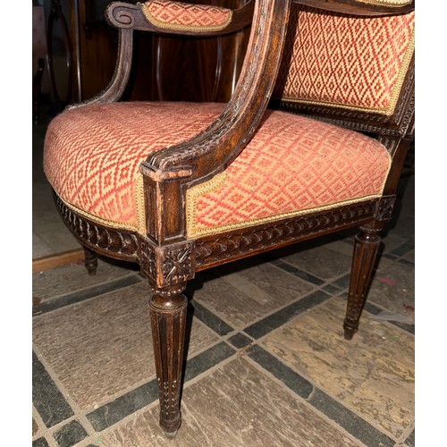 119 - A good quality well upholstered open armchair with carved wood surround.