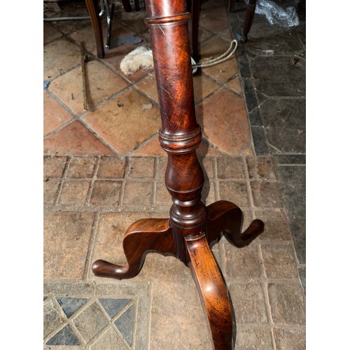 123 - A 19thC mahogany tilt top pedestal table with circular top. 59 d x 73cm h.