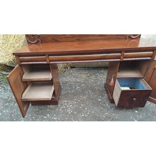 125 - A 19thC mahogany twin pedestal sideboard with three drawers over two cupboards, slides to one side a... 