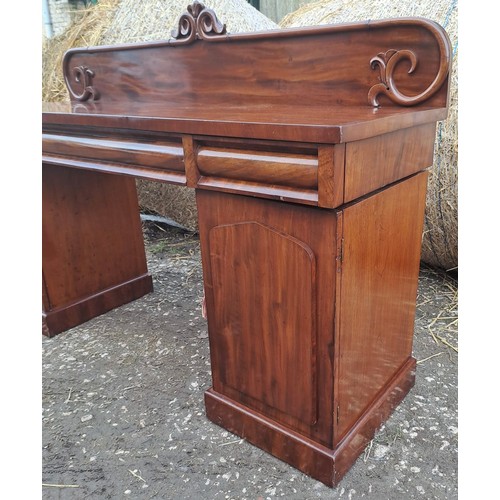 125 - A 19thC mahogany twin pedestal sideboard with three drawers over two cupboards, slides to one side a... 