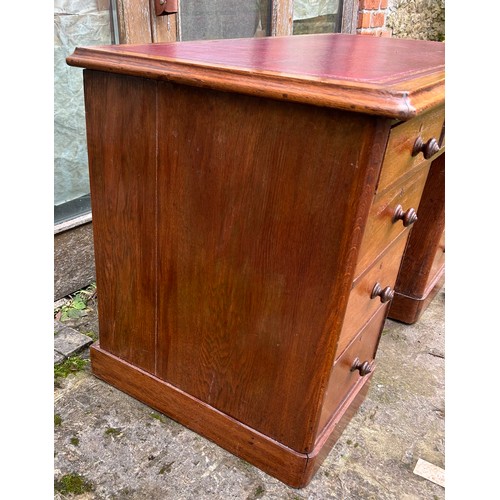 126 - A 19thC oak pedestal desk with tooled red leather top. 123cm w x 75cm h x 62cm d.