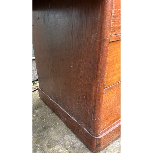 126 - A 19thC oak pedestal desk with tooled red leather top. 123cm w x 75cm h x 62cm d.