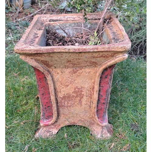 10 - A reconstituted stone planter with red colour to corners. 36 h x 32 w 32cm d.