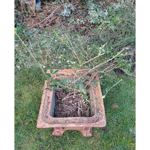 10 - A reconstituted stone planter with red colour to corners. 36 h x 32 w 32cm d.