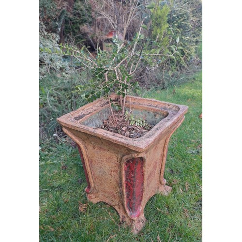 10 - A reconstituted stone planter with red colour to corners. 36 h x 32 w 32cm d.