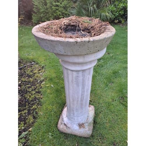 11 - A reconstituted stone bird bath on column base. 74 h x 36cm d.