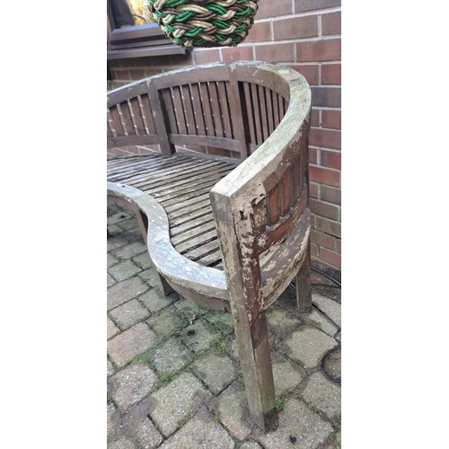 12 - A teak garden bench with serpentine front. 57 h x 152 w x 56cm d. 44cm h to seat.