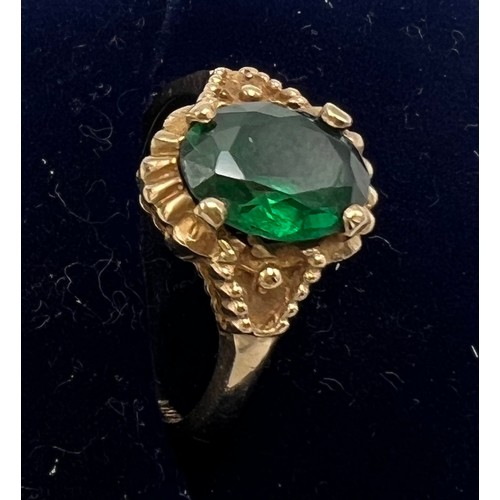 633 - Nine carat gold ring set with green paste stone. Size O. Weight 2.4gm.