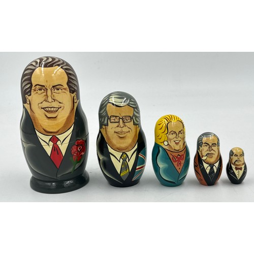 21 - A set of five Ckazka Matrioshka nesting dolls depicting British leaders. Tallest 15cm h.