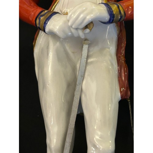 403 - A collection of four Dresden Soldier figurines to include Officer of Royal Artillery Horse Brigade, ... 