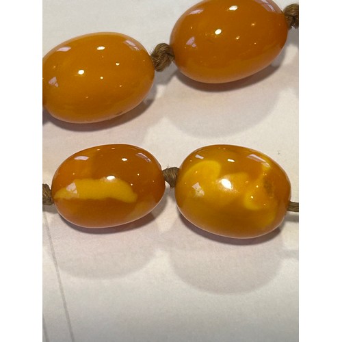 609 - A butterscotch amber necklace. Weight 34.2gm. Length 60cm.