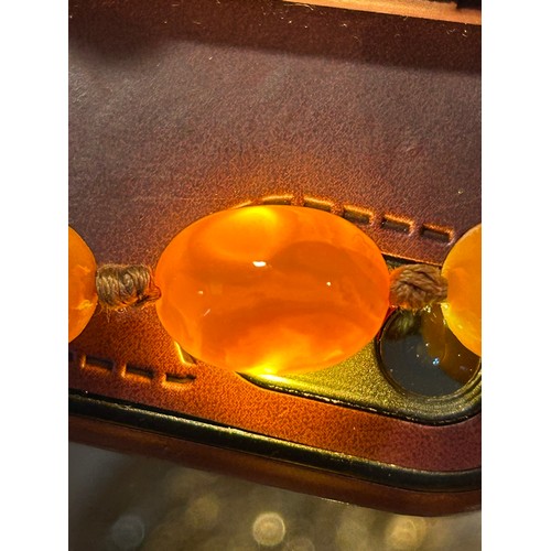 609 - A butterscotch amber necklace. Weight 34.2gm. Length 60cm.