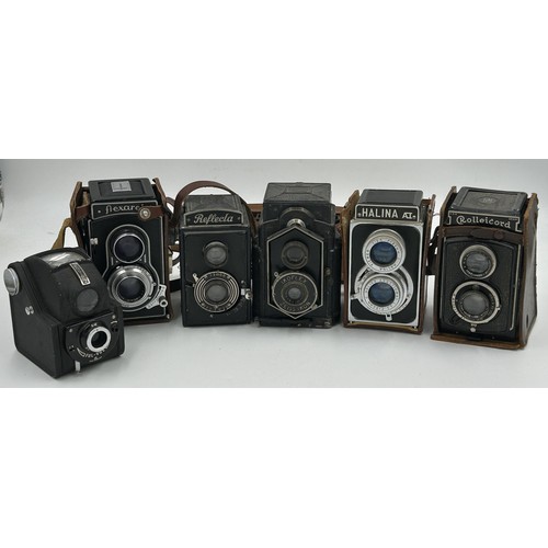 A collection of vintage cameras to include Rolleicord TB