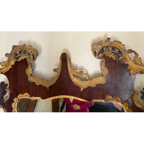 1284 - Mahogany and gilt fretwork mirror. 116cm x 69cm.