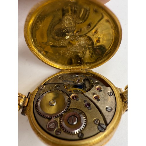 995 - An 18ct gold ladies wristwatch on expanding gold strap marked 18ct. Total weight 25.65gm.