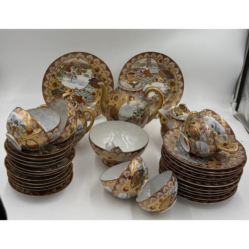 16 - An oriental tea service comprising 12 plates, 12 saucers, 9 cups, teapot, milk jug and sugar bowl.