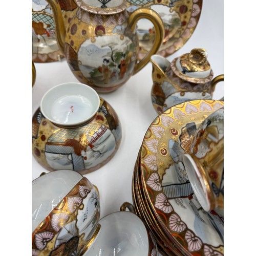 16 - An oriental tea service comprising 12 plates, 12 saucers, 9 cups, teapot, milk jug and sugar bowl.