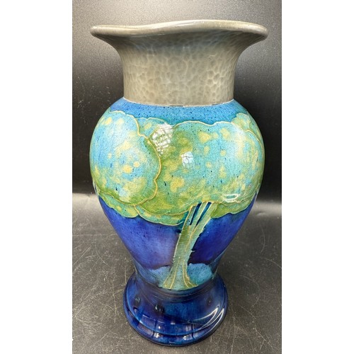 19 - An early 20thC Moorcroft Moonlit Blue pattern pottery vase with hammered pewter neck. 18cm h.