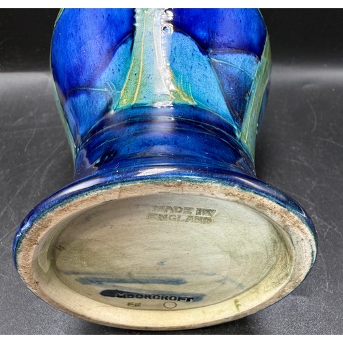 19 - An early 20thC Moorcroft Moonlit Blue pattern pottery vase with hammered pewter neck. 18cm h.
