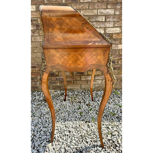 1 - A French style marquetry and parquetry ladies desk with cabriole legs, ormolu mounts and fitted draw... 
