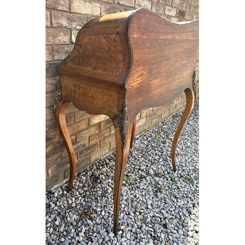 1 - A French style marquetry and parquetry ladies desk with cabriole legs, ormolu mounts and fitted draw... 