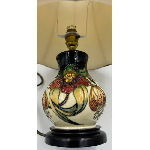 12 - A Moorcroft table lamp in Anna Lily pattern designed by Nicola Slaney 2001 paired with an original s... 