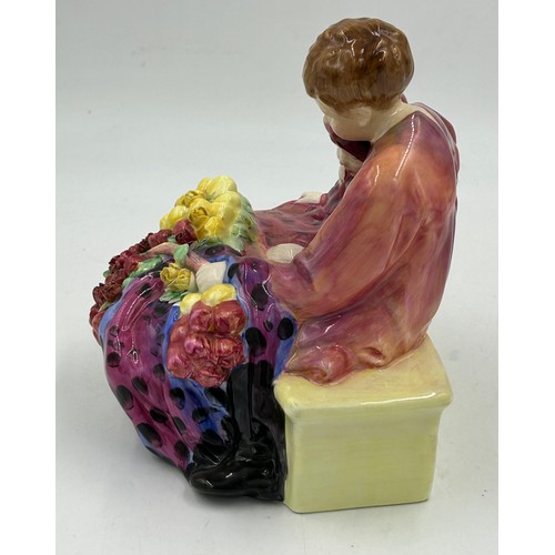 27 - A large Royal Doulton figurine entitled 'Flower Sellers Children' HN1342. Designed by Leslie Harradi... 