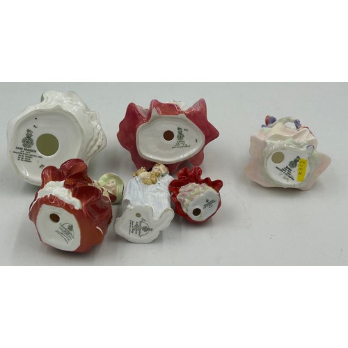 31 - A collection of Royal Doulton Figures to include Babie HN1679, Monica HN1467, Autumn Breezes HN2176,... 