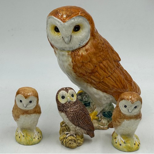 33 - A collection of Beswick birds to include barn owl 1046 19cm, 3 x small barn owls, cockatoo 1180, par... 