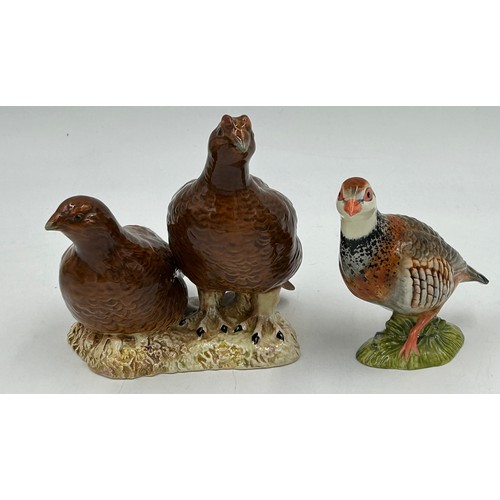 34 - A collection of Beswick birds to include Pheasant 849, Pigeon 1383, Cuckoo 2315, Jay 2417, Pair of G... 