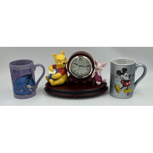 40 - A selection of ceramics to include Disney: Winnie the Pooh clock, 2 x large mugs, 2 x Wedgwood Peter... 